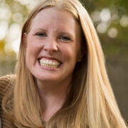 Close up photo of Courtney Matherly. She is wearing her long blonde hair down and a big smile.