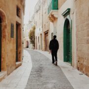 A person exploring historical streets of Malta